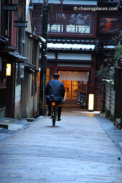 A local cyclist in Kanazawa's Geisha District