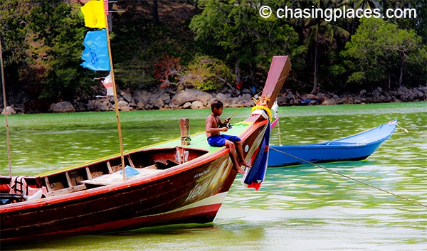 A young fisherman near patong beach Phuket, Thailand