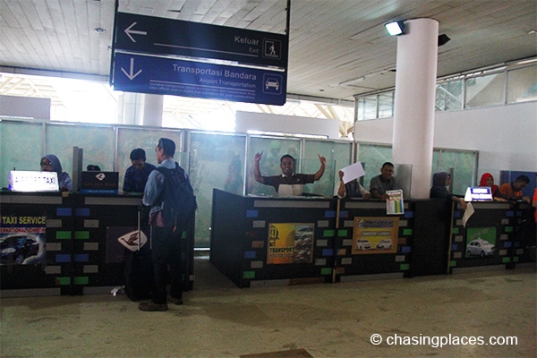 Transport companies have their own desks at the airport. But you can also go out of the airport and negotiate directly with a taxi driver.